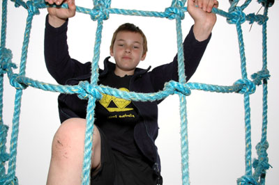 Boy on climbing net