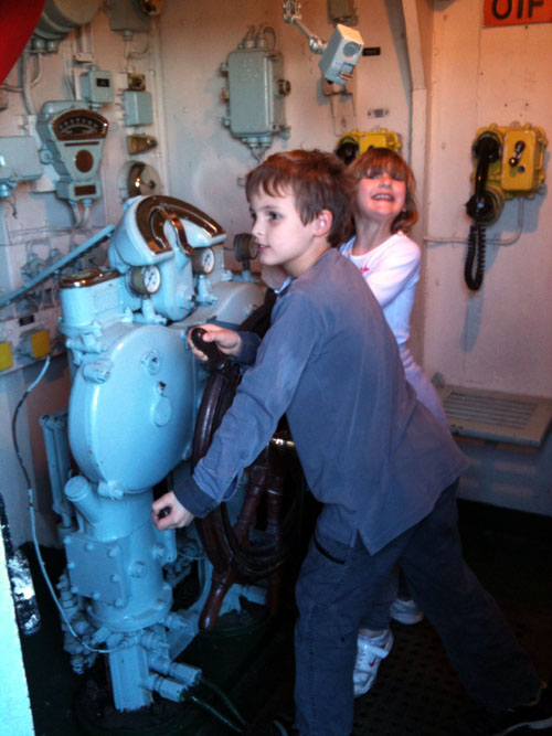Two children using an interactive museum exhibit.